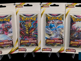 Trois paquets de cartes à collectionner Pokémon sont présentés dans un emballage.