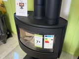 a wood burning stove in the corner of a room