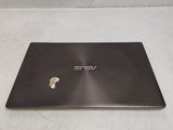 a laptop that has a sticker on the back of it