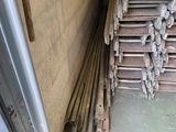 a pile of wood stacked on top of each other in a room
