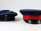 two hats sitting next to each other on a table