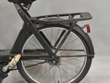 a black bicycle with a basket on the back of it