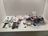 a white table with a bunch of electronics on top of it