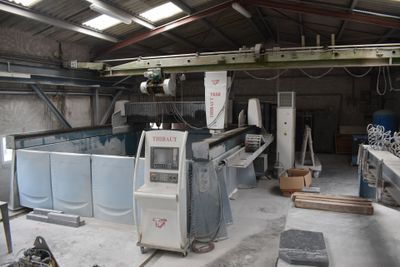 a large machine that is in a building that is being built