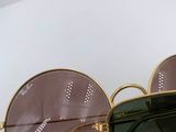 pair of sunglasses on a white plate with a white background