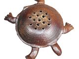 a small metal object that is sitting on a white surface