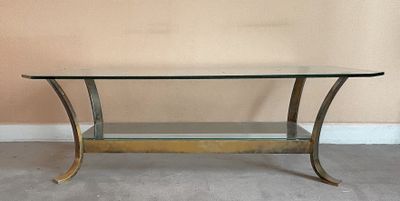 une photo d'une table en verre avec un piètement en métal et un plateau en verre