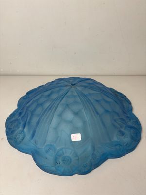 a blue glass bowl sitting on a white counter