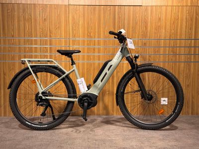 a bike that is parked in front of a wooden wall