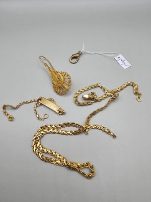 two pairs of gold chains and a pair of earrings