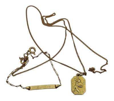 a close up of a necklace with a medal on a chain