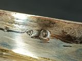 a close up of a piece of wood with water on it