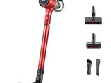 a close up of a cordless vacuum cleaner with a red handle