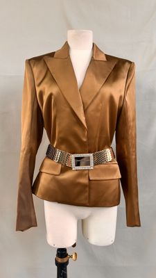 a close up of a mannequin wearing a brown jacket and belt