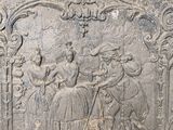 a relief of a man riding a horse and a woman riding a horse