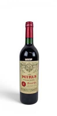 bottle of red wine on a white background with a red cap