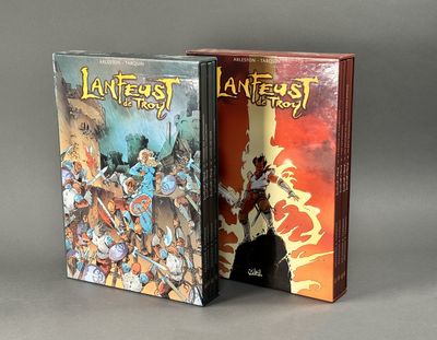 the two books are sitting side by side on a gray surface