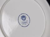 a white plate with a blue and white design on it