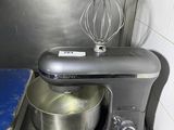 a mixer in the kitchen with a blue mat on the floor