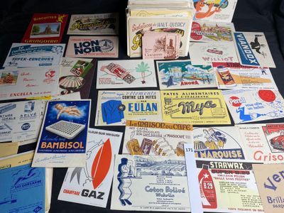 many different types of advertising cards laid out on a table