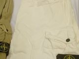 a pair of white pants and a pair of beige pants