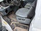 an image of the inside of a van with the driver ' s seat down