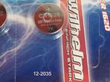 two batteries sitting on top of each other on a card
