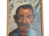 un tableau représentant un homme moustachu, dans un cadre en bois