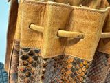 a close up of a purse with a zipper on it