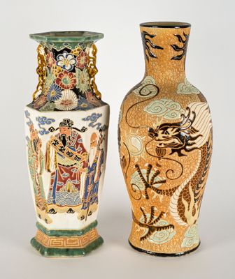 two vases sitting side by side on a white surface