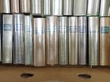 many rolls of tin foil sitting in a box