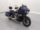 a blue motorcycle that is parked in a room