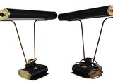 pair of black and gold desk lamps on metal legs