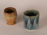 two cups sitting next to each other on a table