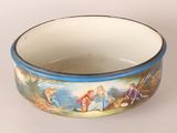 a bowl with a painting on it sitting on a table