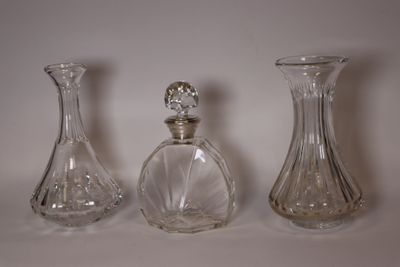 three glass vases sitting next to each other on a table