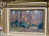 a picture of a painting of a forest in a gold frame