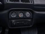 a car dashboard with gauges and a clock on it