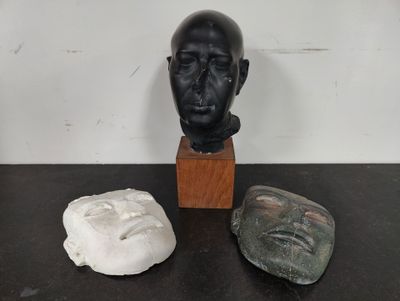 three pieces of art that are on a table