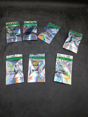six packs of pokemon trading cards sitting on a black surface
