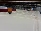 an image of a large warehouse with a lot of lights