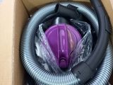 a box with a vacuum and a hose in it