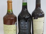 three bottles of wine sitting next to each other on a table
