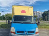 a blue van parked in a parking lot with a yellow box on the back of it