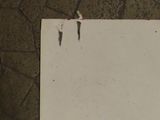a piece of paper that has been torn off on the floor