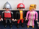 three different types of playmobils sitting on a shelf