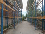 an image of a walkway with scaffolding in a warehouse