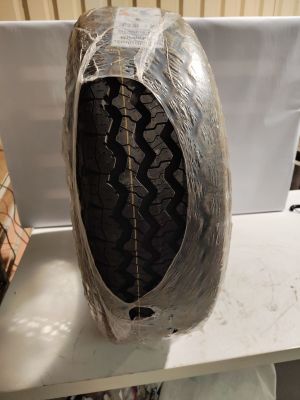 a tire that has been wrapped in plastic on a table