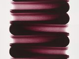 an image of a black and white photo of some red paint