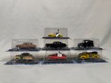 five different models of cars in a display case